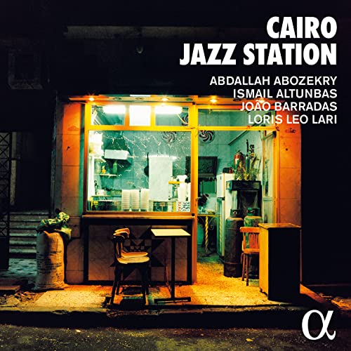 CD cover for "Cairo Jazz Station" featuring a brightly lit storefront at night.