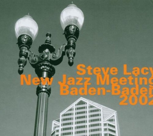 "CD cover with lamppost, building, and orange text on a green background."