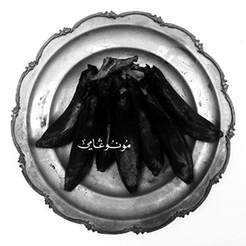 Black plantains on a decorative silver plate, black and white image.