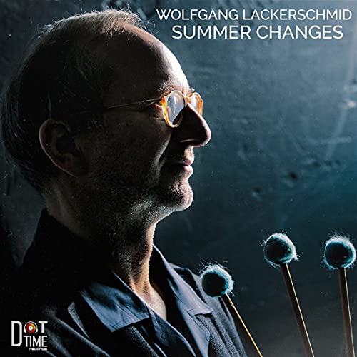 CD cover: profile of a man with glasses and mallets, blue background.