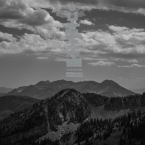 Black and white album cover with mountains and stylized text.