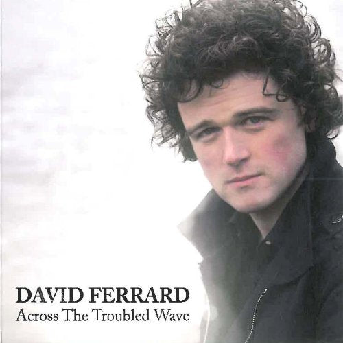 CD cover featuring a man with curly hair, wearing a dark jacket, against a white background.