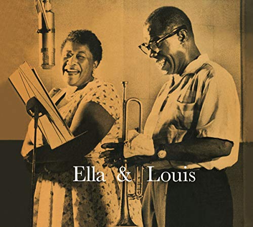 Ella Fitzgerald and Louis Armstrong smiling while performing with microphones and trumpet.