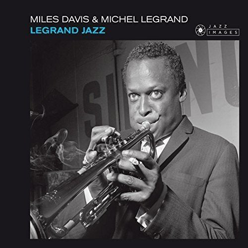 "CD cover with a black-and-white photo of Miles Davis playing trumpet."