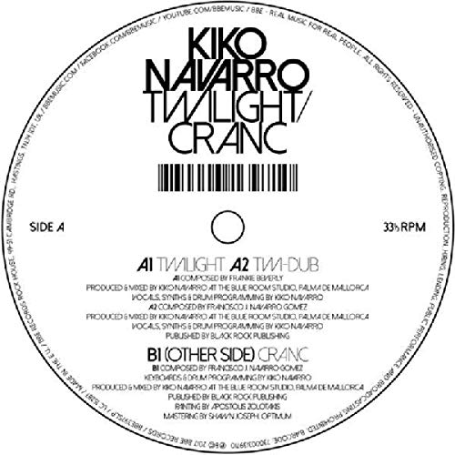 A vinyl record cover with abstract, multicolored paint splatters on a white background.