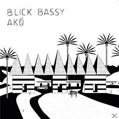 "Black and white illustration of pyramids and palm trees on a CD cover."
