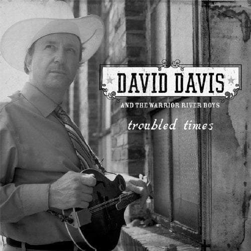 Black and white album cover with man holding mandolin and wearing cowboy hat.
