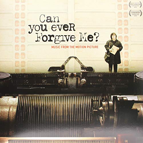 Vinyl cover art featuring a typewriter and a woman standing in the background.