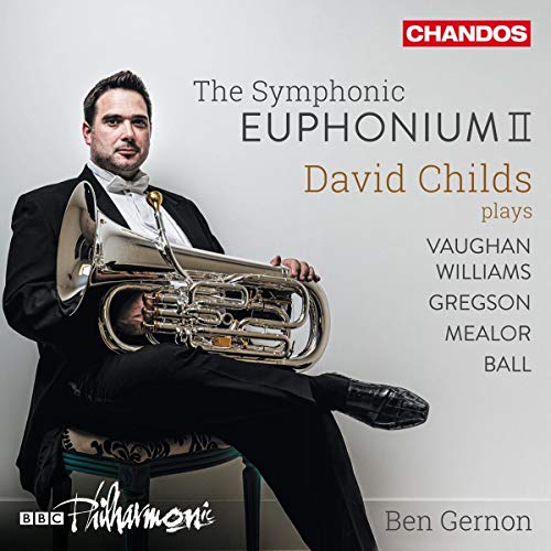 Man in tuxedo holding euphonium, seated on a chair, on a CD cover.