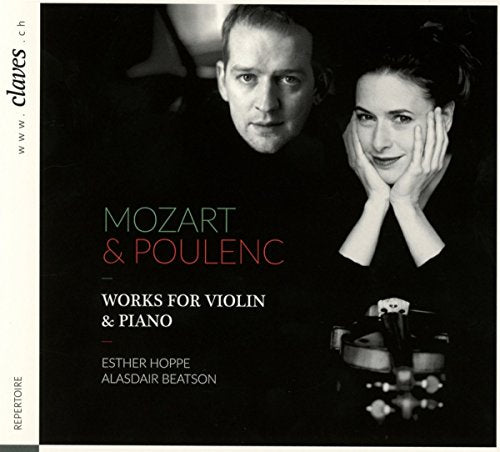 CD cover with black background, featuring a man and woman, and violin.