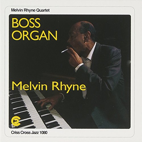 Album cover featuring a man in a suit playing an organ, smoking a cigarette.