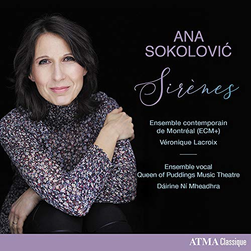 CD album cover featuring a woman with dark hair against a black background.
