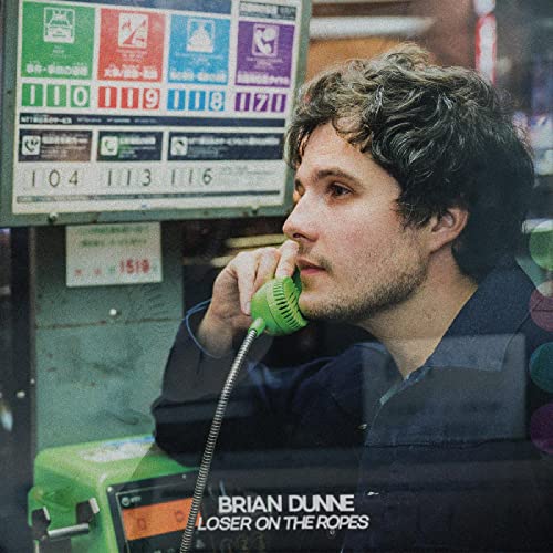 Album cover featuring Brian Dunne with a vintage payphone, muted colors.