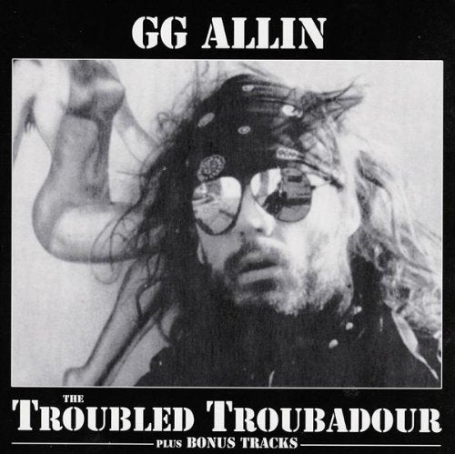 G.G. Allin CD cover with a man in sunglasses and a nude figure.
