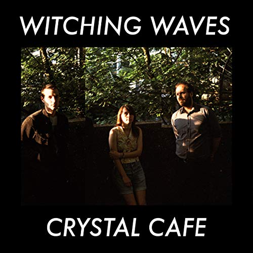 Album cover featuring three people standing before lush greenery.