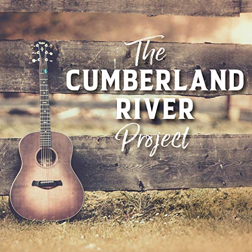 Acoustic guitar leaning against a weathered wooden fence, album cover.