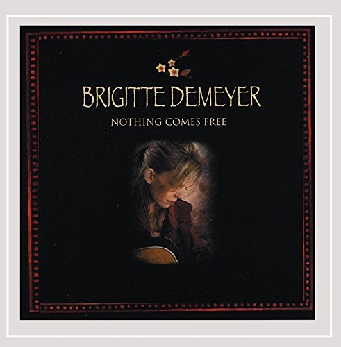 "CD cover with a woman holding a guitar, surrounded by a black and red border."