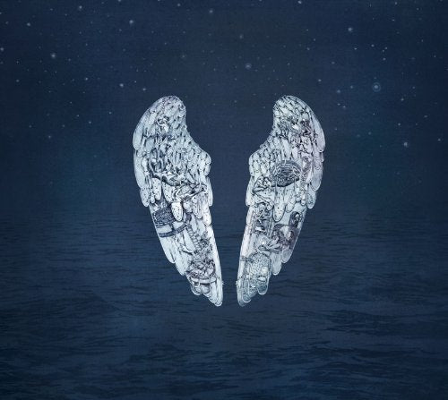 A pair of white, ornate angel wings floating above dark blue water and stars.