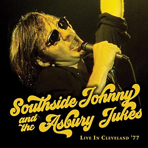 Southside Johnny singing into a microphone, album cover for live concert.
