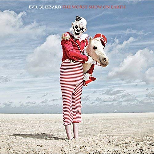 CD cover: clown in military jacket with a horse head in a field.