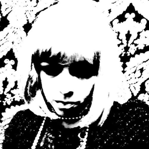 High-contrast black and white portrait of a person with bangs and sunglasses.