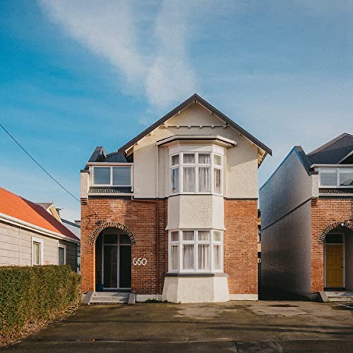 CD cover featuring a two-story brick and white house with number 660.