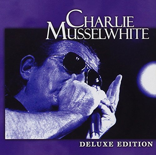 "CD cover with a man playing harmonica, wearing sunglasses, on a purple background."