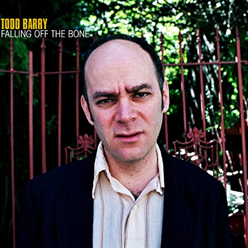 CD cover featuring comedian Todd Barry with a red gate background.