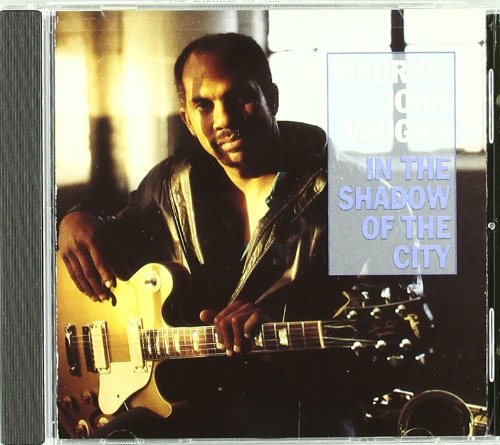 Maurice John Vaughn holding a guitar, with album title text overlay on the right.