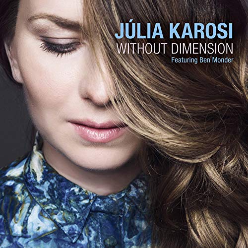 Júlia Karosi's album cover: a woman with closed eyes and flowing brown hair.