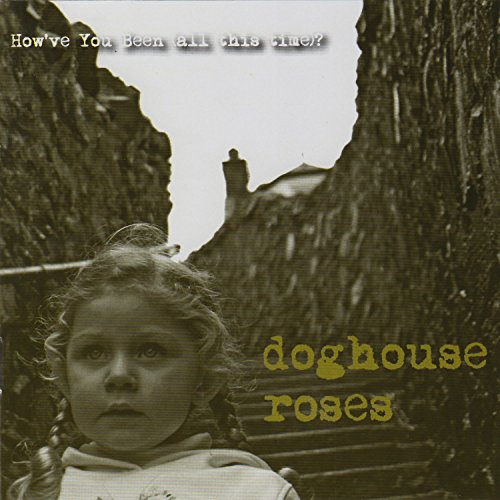 "Album cover featuring a young girl standing between two tree trunks, sepia-toned with text overlay."