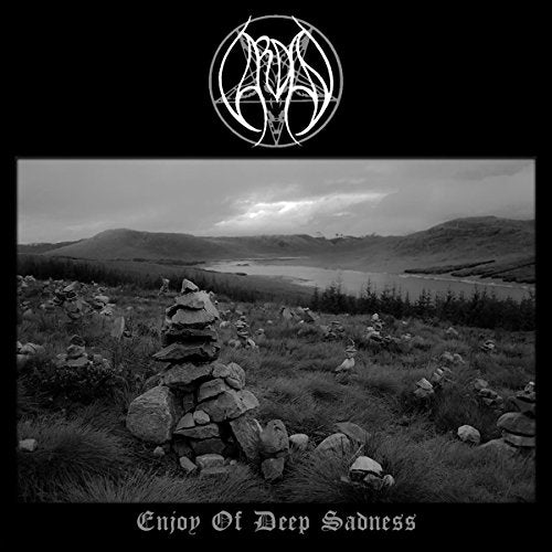 Black and white CD cover with landscape, stacked stones, and ornate logo.