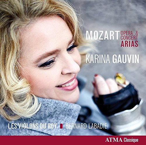 A blonde woman smiles, holding a violin on a classical music CD cover.