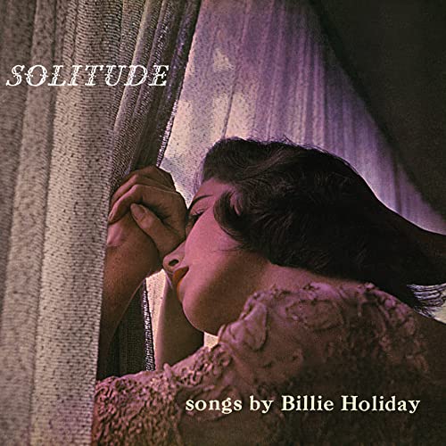 Billie Holiday album cover, "Solitude," featuring a profile against curtains.