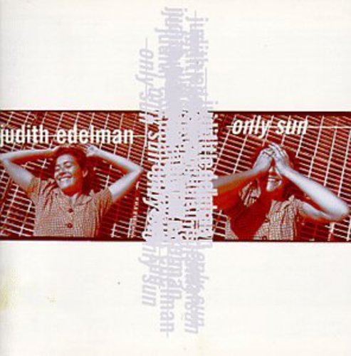 "CD cover with a woman in front of a grid, hands on head."