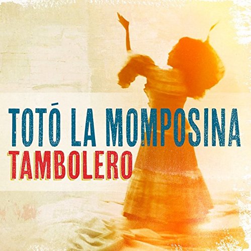 "CD cover featuring a woman dancing with drumsticks, orange-toned background, and artist's name."