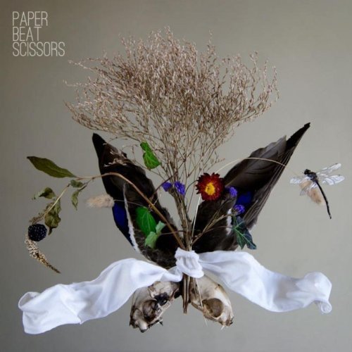 "Album cover with bouquet of flowers, leaves, and animal skull tied with white cloth."
