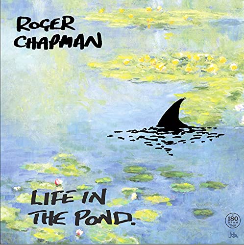 Vinyl album cover: pond water with a shark fin, text reads "Life In The Pond.