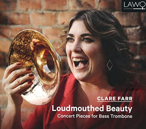Woman smiling, holding a large brass bass trombone, CD cover art.