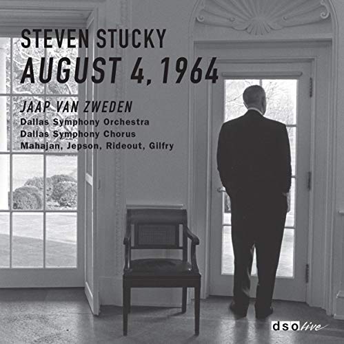 CD cover: Man in suit stands before a window and chair.