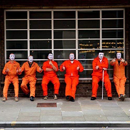 Six people in orange jumpsuits and white masks pose outdoors.