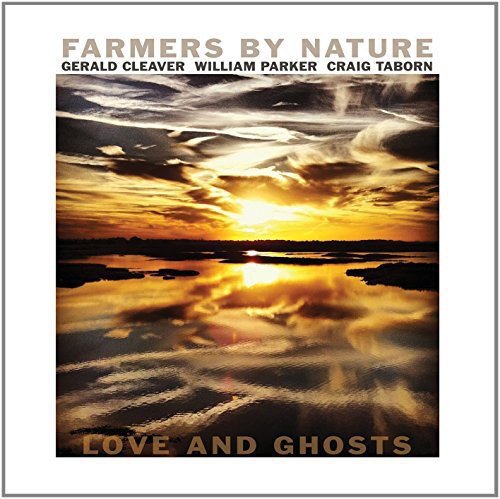 "Album cover with a serene sunset over water, titled 'Love and Ghosts'."