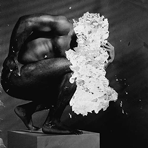 Black and white album cover featuring a crouching, muscular figure.