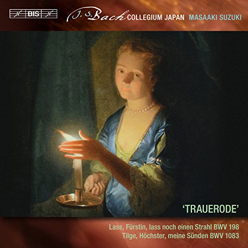 A CD cover featuring a woman holding a lit candle in a dark room.