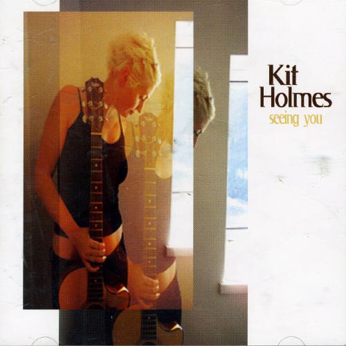 CD cover for Kit Holmes’ “Seeing You” featuring a musician with a guitar.