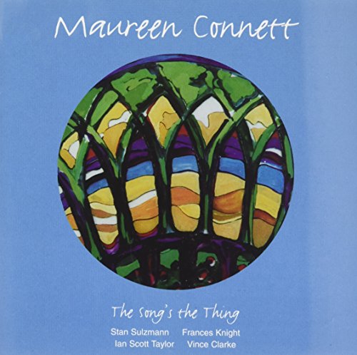 A blue CD cover with a stained-glass tree design and artist names listed.