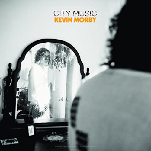Album cover featuring a man looking at his reflection in an ornate mirror.