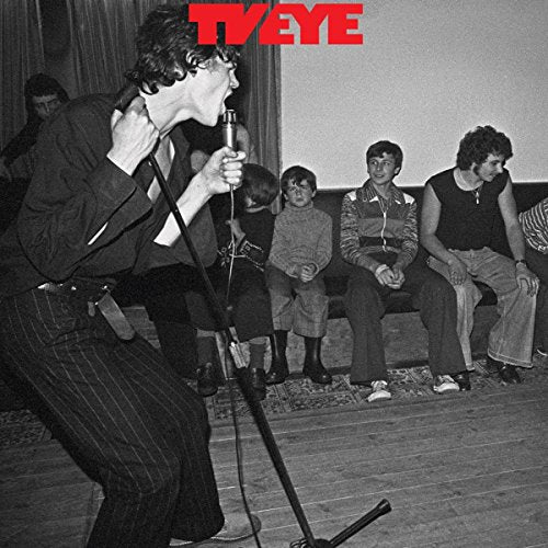 Black and white album cover featuring a singer performing with an audience.