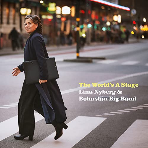 CD cover: woman walking across a street, album title visible.