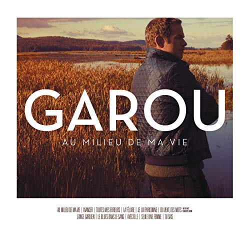 CD cover for Garou’s “Au Milieu De Ma Vie” featuring a man in a field.